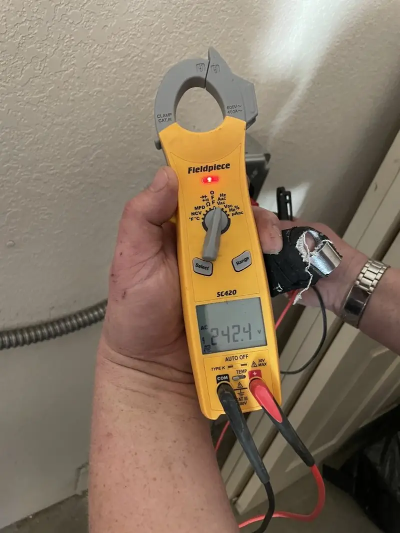 Voltage testing with clamp meter during Outlet Installation in Ceres